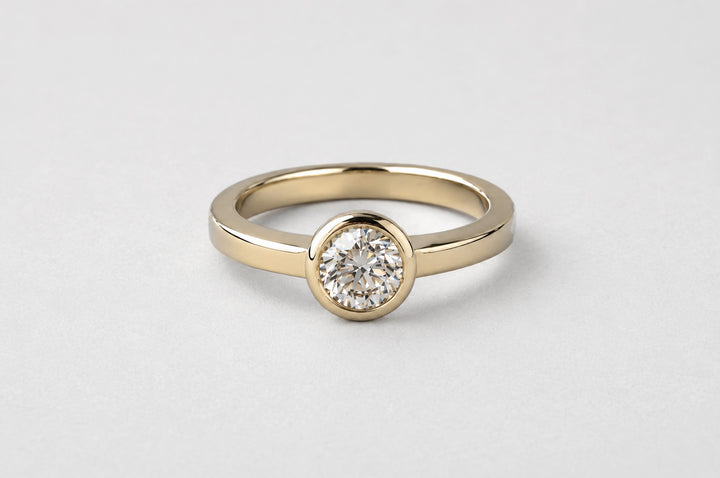 BEZEL SET DIAMOND SOLITAIRE RING | YELLOW GOLD